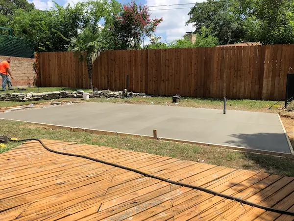 Laying concrete for a swim spa delivery and installation