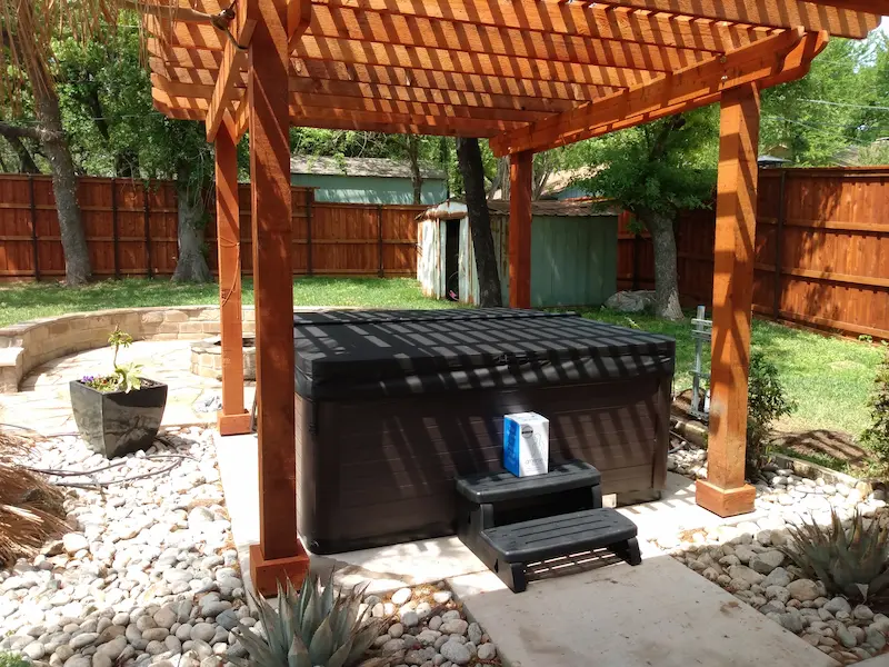 Vita Spa installed under a pergola