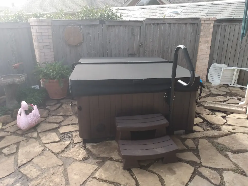 Vita Spa hot tub installed on a patio