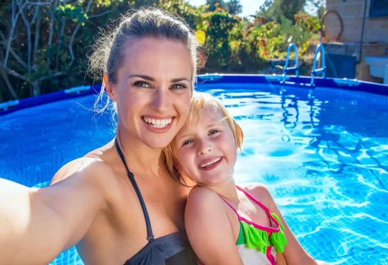 Woman and daughter swimming after deciding between an above-ground pool vs. swim spa in Weatherford, Texas.