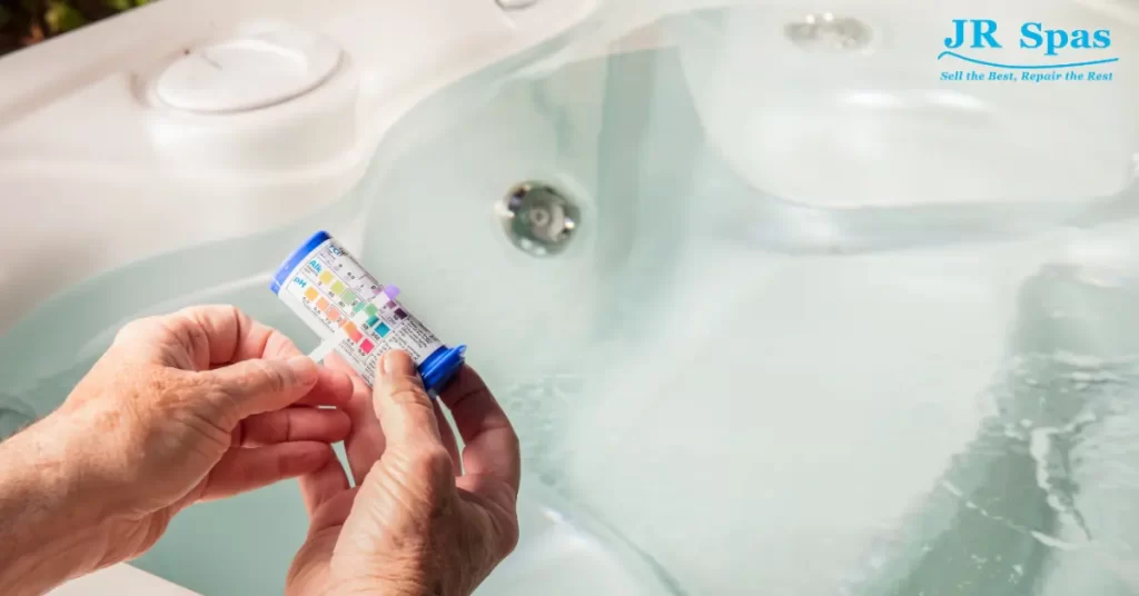 Person testing pH levels in hot tub water. 